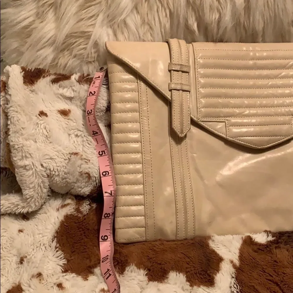 Reece Hudson cream colored clutch‎